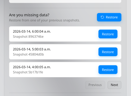 Snapshot history list with multiple restore points and Restore buttons.